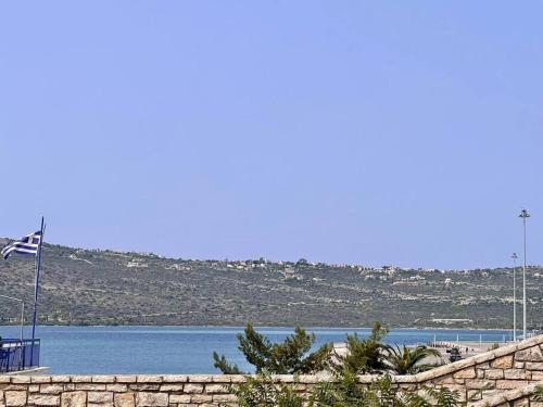 a view of a body of water with a flag at Souda Bay in Souda