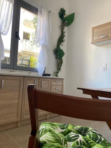 a bedroom with a window and a bed at Paola’s apartments near Athens Airport in Spáta