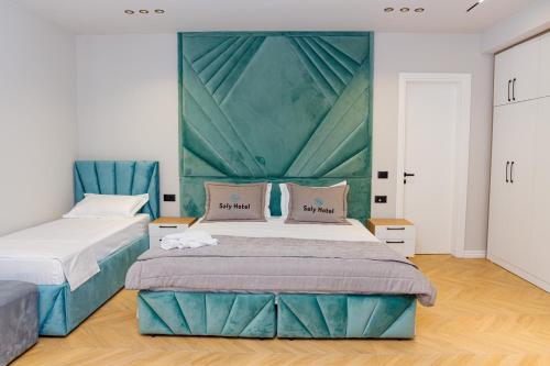 Postel nebo postele na pokoji v ubytování Hotel Saly