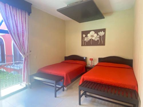 Postel nebo postele na pokoji v ubytování HOTEL TIBERIADES