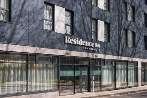 a building with a sign on the side of it at Residence Inn by Marriott Essen City in Essen