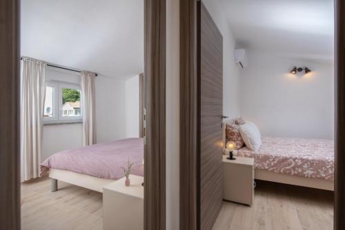 Ένα ή περισσότερα κρεβάτια σε δωμάτιο στο Kuća za odmor Nika