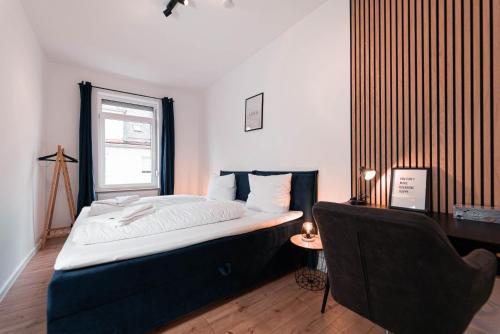 Ένα ή περισσότερα κρεβάτια σε δωμάτιο στο unique Cityresidenz nähe Münster - WE02