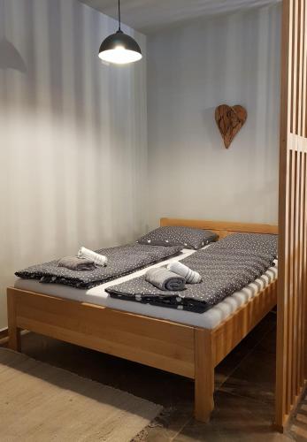 two beds in a room with at 4 you in Lovinac