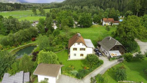 an aerial view of a house and a river at Appartments am Waldbad - Unterm Nussbaum in Rassing