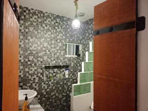 a bathroom with a sink and a toilet in a room at Casa Azul in La Paz