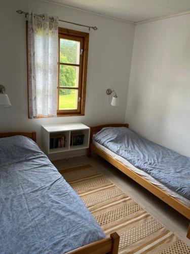 Postel nebo postele na pokoji v ubytování Nya Matsas