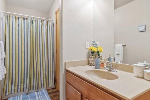 a bathroom with a sink and a shower at Convenient Townhouse - Near Airport in Rapid City