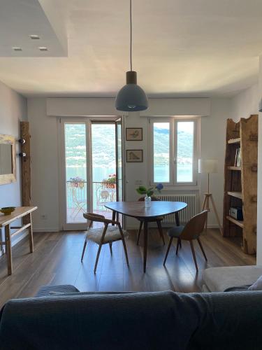a living room with a table and a couch at ORO, 8 in Bellano