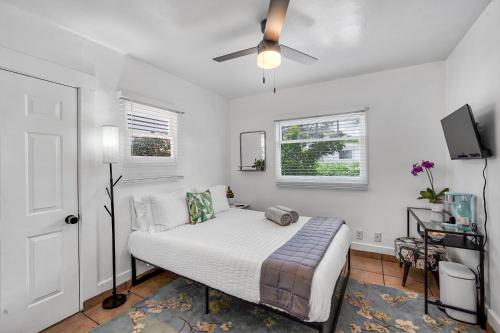 a bedroom with a bed and a ceiling fan at Cactus Room - Private Entrance in Santa Barbara