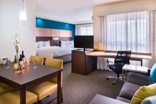 a hotel room with a bed and a desk at Residence Inn by Marriott Temecula Murrieta in Murrieta
