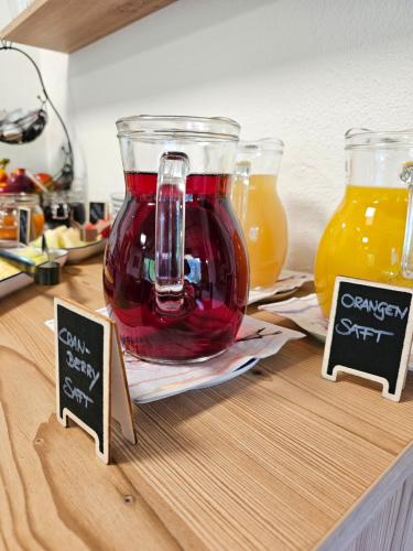 a jar of red liquid sitting on top of a counter at Bergkristall B&B in Berwang