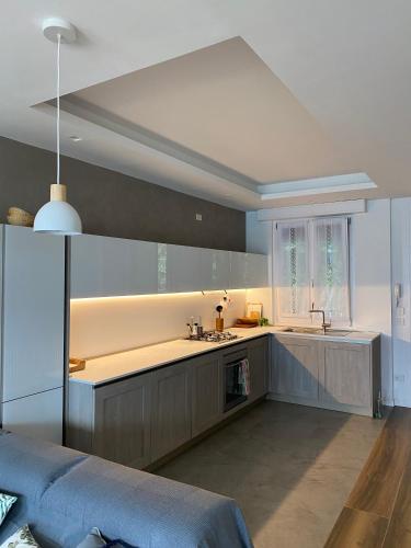 a kitchen with a sink and a counter top at ORO, 8 in Bellano