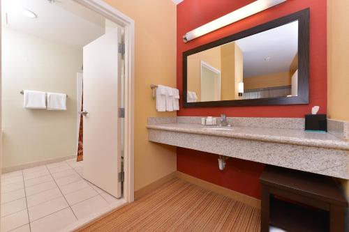 a bathroom with a sink and a mirror at Courtyard Mt. Holly Westampton in Westampton Township