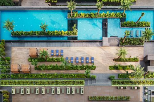 an overhead view of a building with a swimming pool at The Ritz-Carlton, Pune in Pune