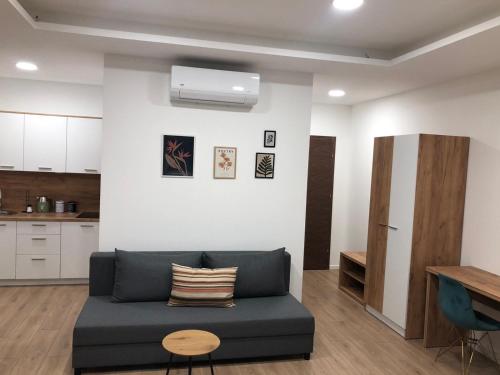 a living room with a couch and a table at Green River in Konjic