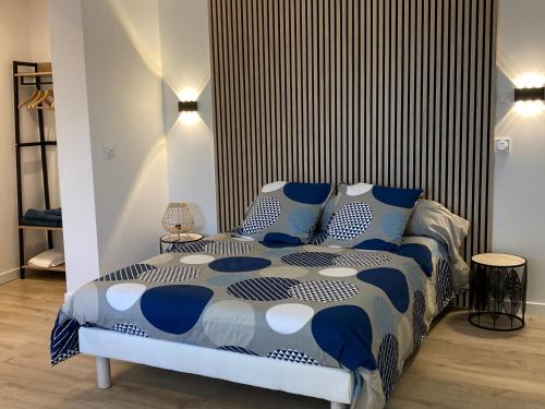 Ένα ή περισσότερα κρεβάτια σε δωμάτιο στο Studio au couleur de l’océan