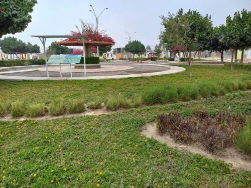 a park with a circle in the middle of a field at Casa Herrera in Ica