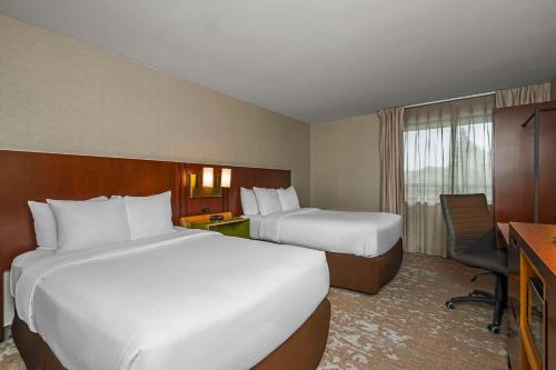 Ένα ή περισσότερα κρεβάτια σε δωμάτιο στο Comfort Inn