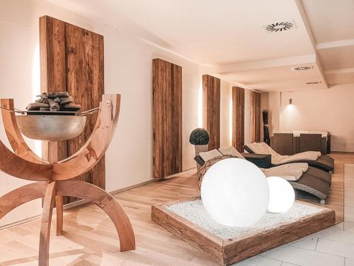 a living room with a couch and a table at AlpenLuxus' LUNA with relaxation room, sauna & car park in Seefeld in Tirol