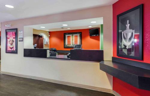 a waiting room with orange walls and a hair salon at Extended Stay America Suites - Los Angeles - Arcadia in Arcadia