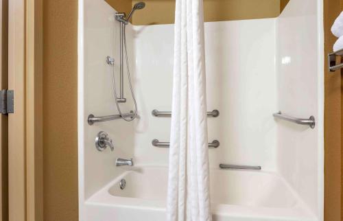 a bathroom with a shower and a bath tub at Extended Stay America Suites - Chicago - Schaumburg - I-90 in Schaumburg