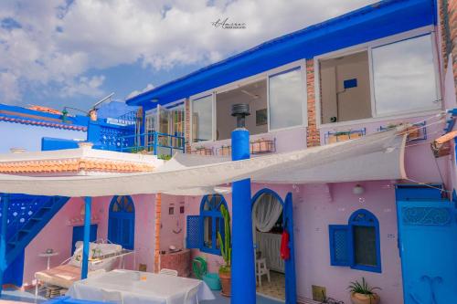 a toy house with blue and pink at DAR DAUIA in Chefchaouene