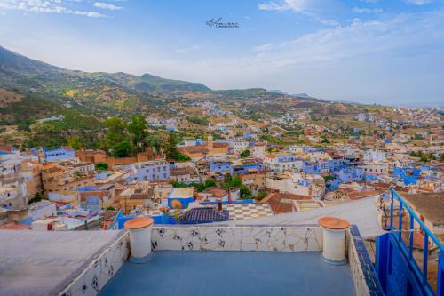 a view of a city from the balcony of a building at DAR DAUIA in Chefchaouene