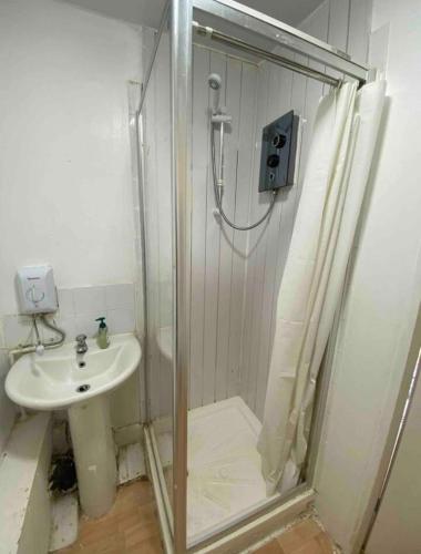 a bathroom with a shower and a sink at RHB Apartments in Leicester