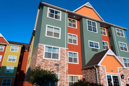 a large building with many different colored houses at Residence Inn Columbia in Columbia