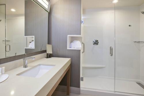 a bathroom with a sink and a shower at Courtyard by Marriott St. Joseph-Benton Harbor in Benton Harbor