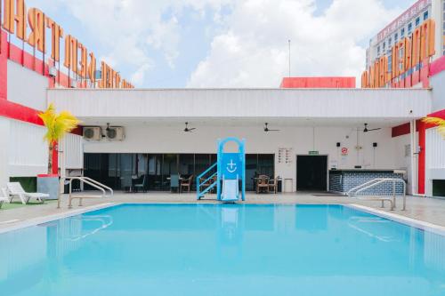 a large pool in front of a building at Hotel Sentral Melaka @ City Centre in Melaka