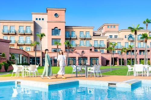 a rendering of two people walking by a pool at Ooedo Onsen Monogatari Premium Saikaibashi in Sasebo