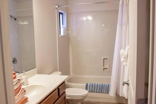 a bathroom with a sink and a toilet and a tub at Carnelian Coyote - Fabulous Condo in West Sedona! in Sedona