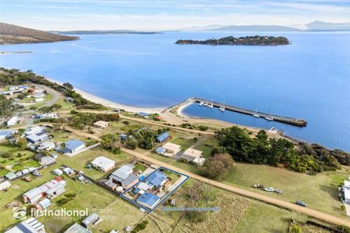 an aerial view of a large body of water at Island Escapes in Alonnah