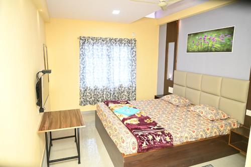 Ένα ή περισσότερα κρεβάτια σε δωμάτιο στο Hotel Nakshatra Resort