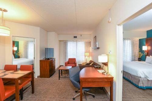 a hotel room with a bed and a desk at Residence Inn Cincinnati North West Chester in West Chester