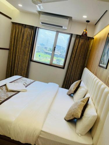 Tulsi Hotelにあるベッド