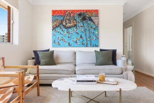 a living room with a couch and a table at Randwick l 3 Bedroom Apartment + Parking in Sydney