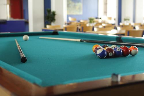 a pool table with balls and a cue at 62N Guesthouse Marknagil in Tórshavn