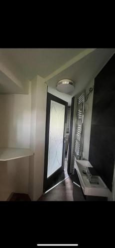 a hallway with a door and a window in a room at Ivybank Villa in Rothesay