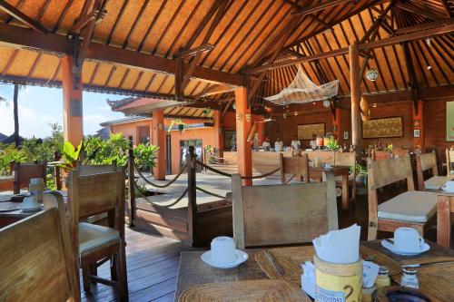 Restoran või mõni muu söögikoht majutusasutuses Satriya Cottages