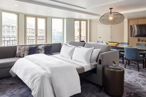 a living room with a bed and a couch at Westin Georgetown, Washington D.C. in Washington