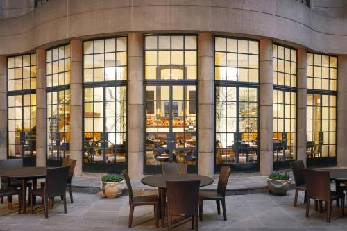 a group of tables and chairs in front of a building at Westin Georgetown, Washington D.C. in Washington