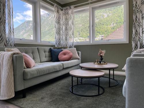 a living room with a couch and a table at Leilighet i Odda sentrum in Odda