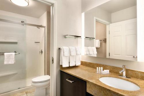 a bathroom with a sink and a toilet at Residence Inn Denver City Center in Denver