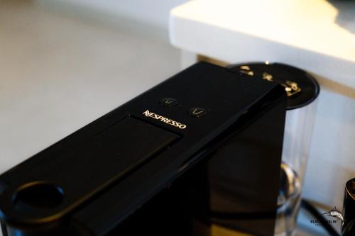a black cellphone sitting on top of a table at Black Marlin Apartments in Pereybere