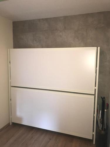 a large white garage door in a room at Alpendomizil Pia in Mühlbach am Hochkönig