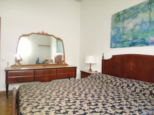 Posteľ alebo postele v izbe v ubytovaní Camera in stile Novecento