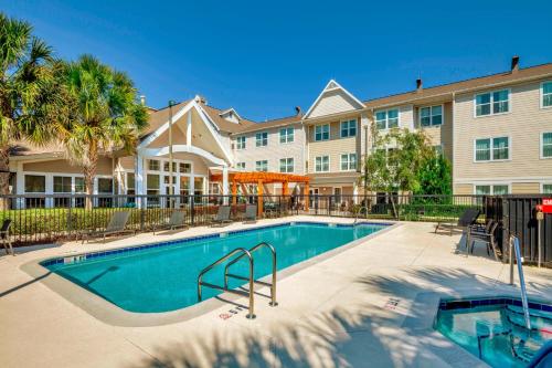 a swimming pool in front of a building at Residence Inn Ocala in Ocala